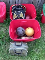 Assorted bowling balls and bags