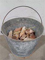 Galvanized Bucket of Knapping Rocks