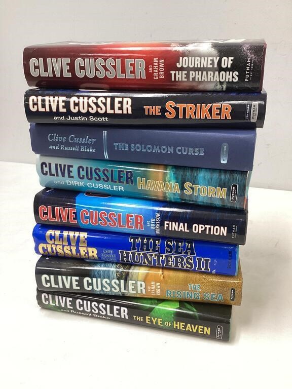 Eight Clive Cussler Books Lot E
