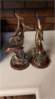 TWO VINTAGE COPPER PAINTED DOLPHIN FIGURINES ON
