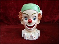 Ceramic clown head vase.