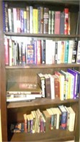 four shelves of books, political, bio, misc