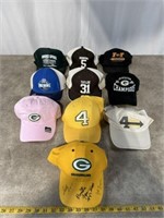 Green Bay baseball hats, one is signed by