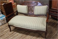 HEAVILY CARVED SETTEE
