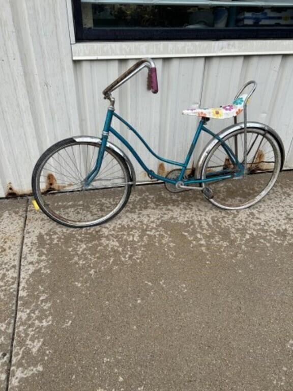 Vintage teal banana seat two wheeled bicycle