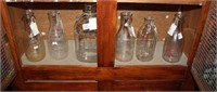 Six Glass Milk Bottles