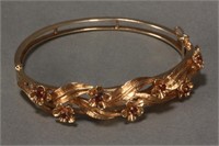 Lady's 14ct Gold and Ruby Bangle,