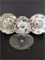 Three beautiful decorative plates and a glass bowl