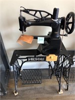 Singer leather treadle sewing machine on wheels