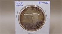 1867 - 1967  800 Silver Dollar, M S - 62