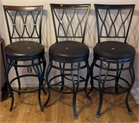 3 barstools with faux leather seats. One pair and
