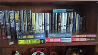 Shelf lot of John Grisham books