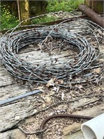 Barbed wire and posts/ metal in trailer