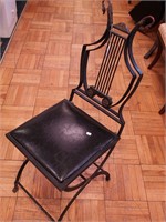 Antique metal chair with wire back decorated