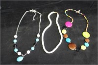 Two Colorful Necklaces, One White Necklace