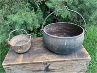 TWO CAST IRON POTS WITH HANDLES