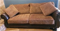 Sofa with throw pillows. 90" Some damage on one