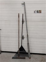 Two rakes and handmade post digger