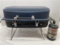 Portable Gas Grill with 1 lb. propane bottle.