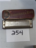 The American Ace Harmonica and Tin
