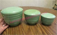 3 old green stackable mixing bowls with lids