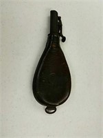 Leather powder flask marked with a seal that says