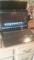Dell Inspiron laptop computer with cord comes on