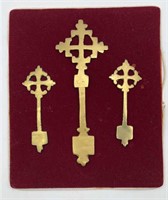Brass Ethiopian Crosses on Red Velvet Background