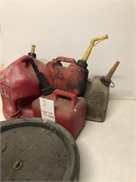 4 gas containers and oil change container