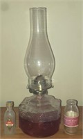 Oil lamp and old bottles.