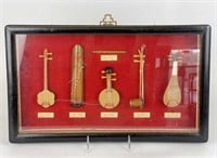 Framed Selection of Miniature Asian Instruments