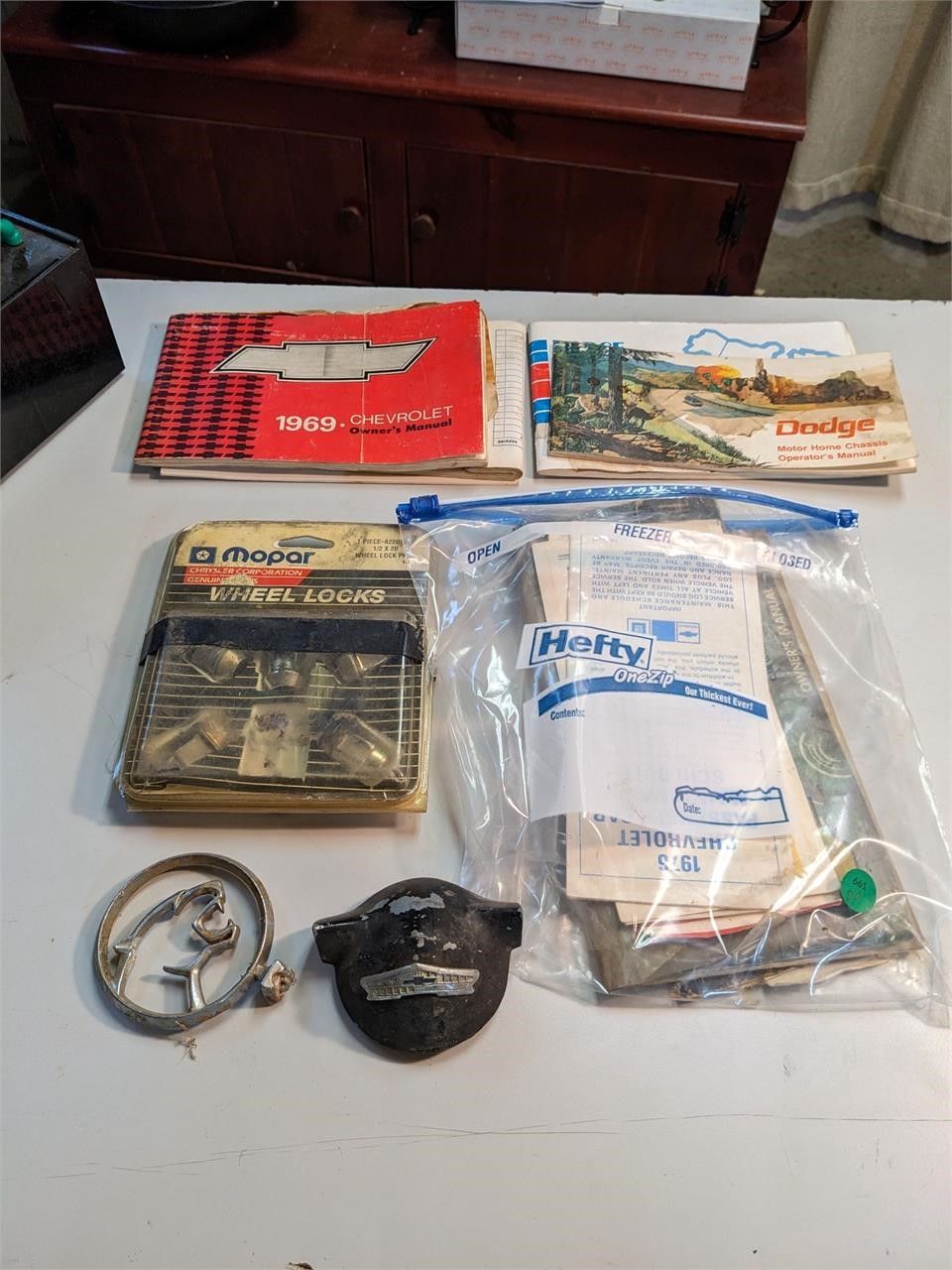 Lot of Misc Owner's Manuals, Badge, Lug Nuts, Etc.