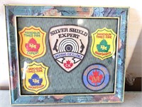 Framed shooting badges