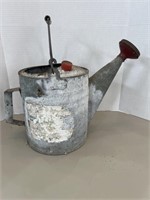 Vintage metal watering can