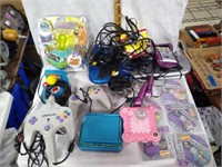 Box Lot of Various Style Game Controllers/Games