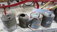 3 metal gas cans and a water can