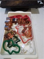 Container with a variety of cookie cutters some