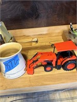 Kubota toy tractor and little crock
