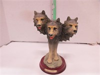3 wolf head statue