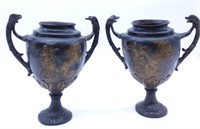 Classically Styled Chariot Motif Bronze Urns.
