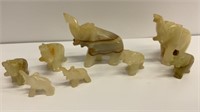 8 alabaster elephant figurines, ones tusks is
