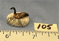 A tiny ivory carving of a Canadian Goose, scrimsha
