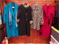 Four women's wool coats: one with faux fur
