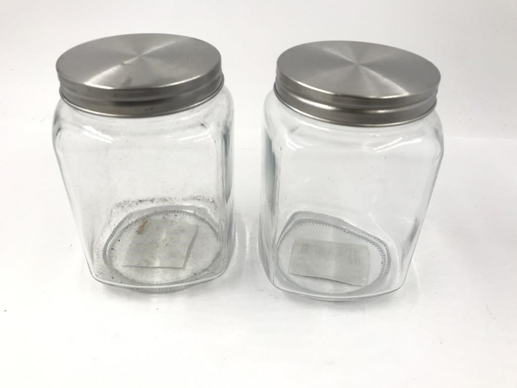 TWO GLASS JARS WITH LIDS