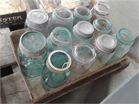 Assorted blue and clear glass jars