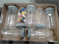 Assorsted clear glass jars with lids