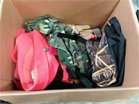 assortment of gloves, hats, stool, tackle box