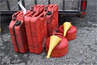 Four red 5 gallon steel Jerry cans, two 2 gallon E