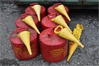 Six red 5 gallon Eagle Safety fuel cans with 12 at