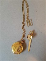 Gold Colored Pocket Watch and Money Clip